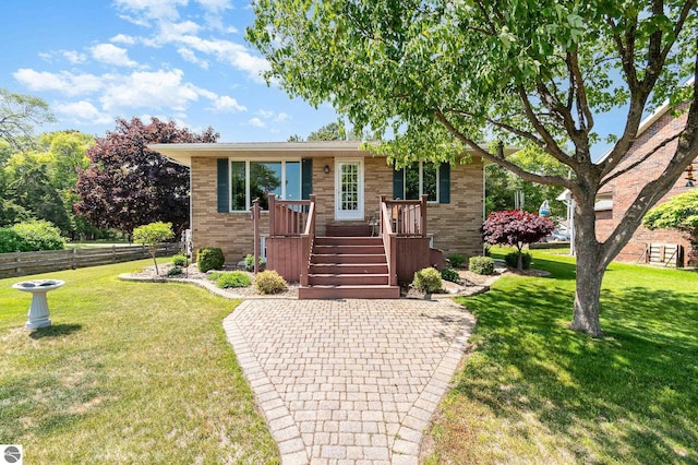 589 Pine Ln, East Tawas, MI 48730 - view of front of property featuring brick siding