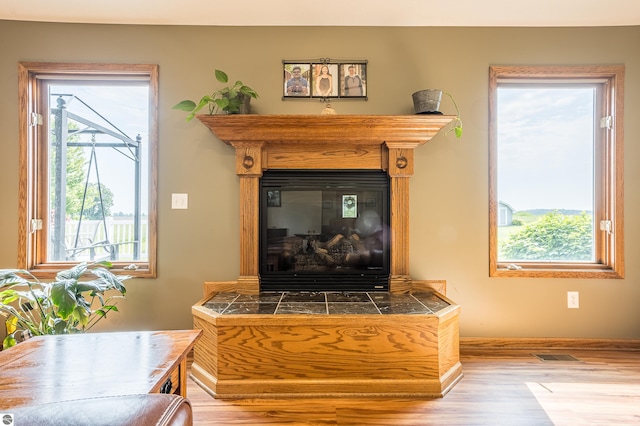 6375 S Isabella Rd, Shepherd, MI 48883 - detailed view of wood finished floors and a tile fireplace