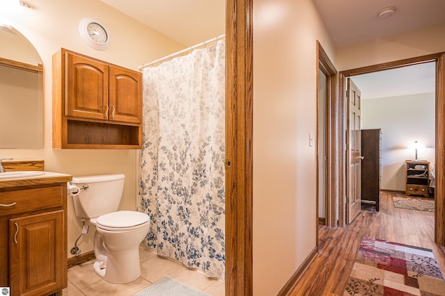 6375 S Isabella Rd, Shepherd, MI 48883 - bathroom with vanity, curtained shower, and wood finished floors