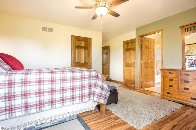6375 S Isabella Rd, Shepherd, MI 48883 - bedroom with wood finished floors and ceiling fan