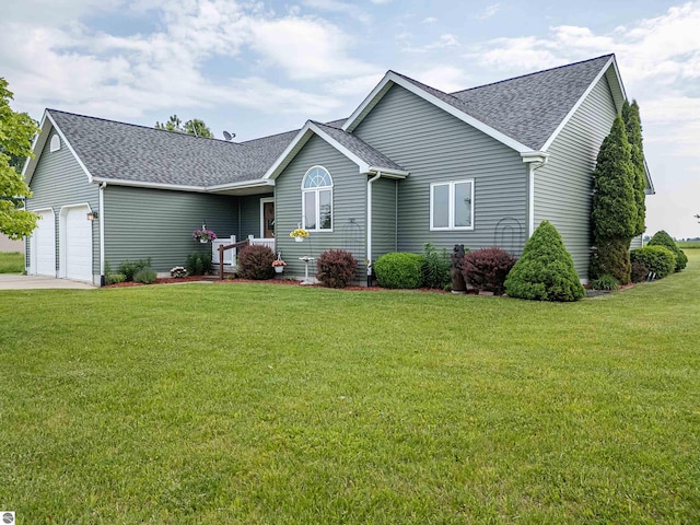 6375 S Isabella Rd, Shepherd, MI 48883 - ranch-style home featuring a garage, roof with shingles, a front lawn, and driveway