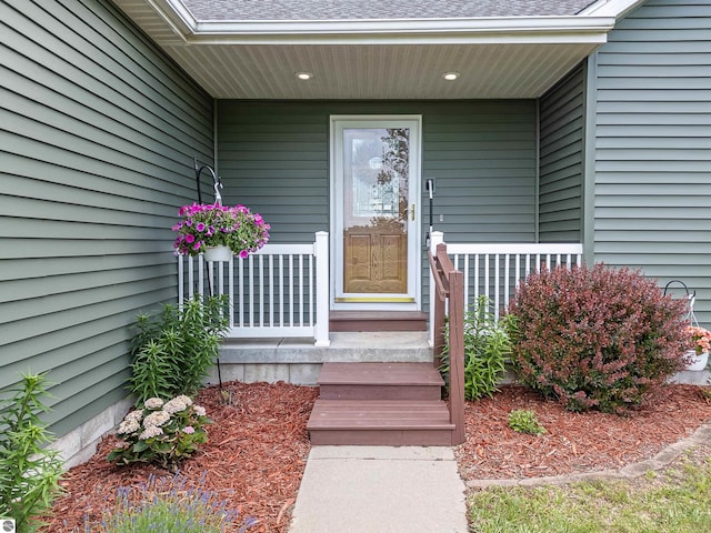 6375 S Isabella Rd, Shepherd, MI 48883 - view of exterior entry with covered porch and a shingled roof