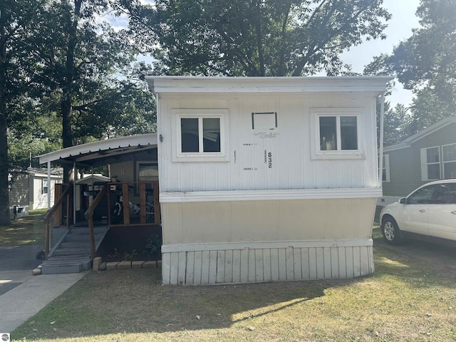 832 Manor Ln, Traverse City, MI 49686 - view of front facade with covered porch