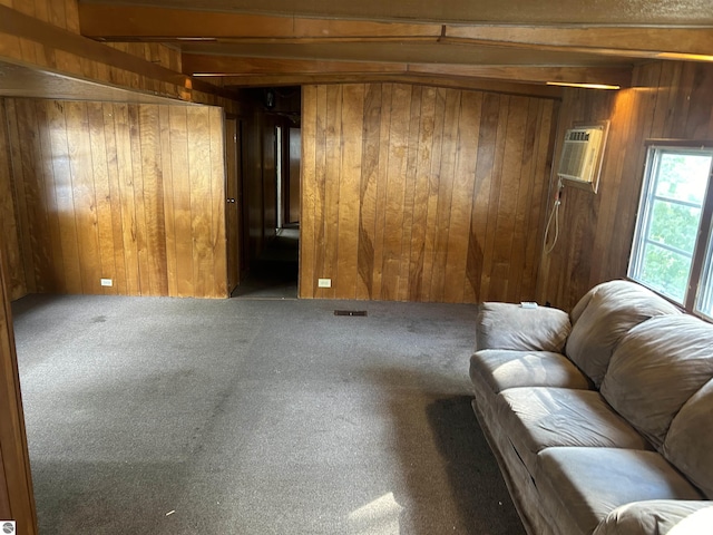 832 Manor Ln, Traverse City, MI 49686 - living room with wooden walls, a wall mounted air conditioner, and carpet floors