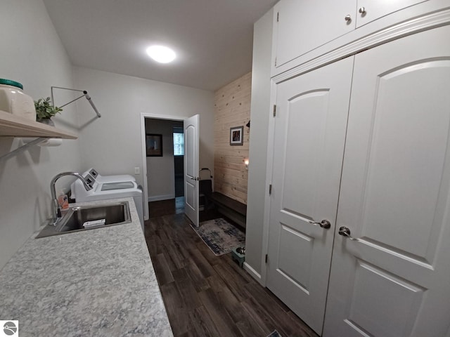 1379 Kunze Rd, East Tawas, MI 48730 - laundry room featuring separate washer and dryer and dark wood-type flooring