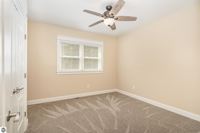 1379 Kunze Rd, East Tawas, MI 48730 - spare room with ceiling fan and carpet floors