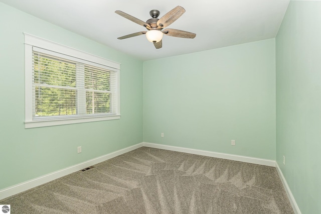 1379 Kunze Rd, East Tawas, MI 48730 - unfurnished room featuring carpet floors and ceiling fan