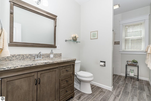 1379 Kunze Rd, East Tawas, MI 48730 - full bathroom with vanity, tiled shower, and wood tiled floors