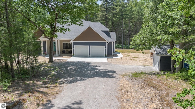 1379 Kunze Rd, East Tawas, MI 48730 - view of front facade with a garage and driveway