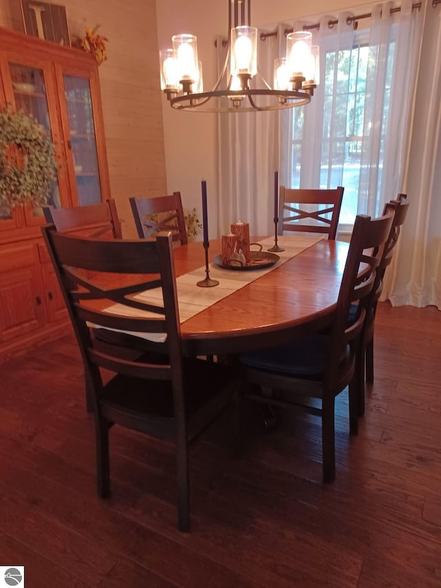 1379 Kunze Rd, East Tawas, MI 48730 - dining space featuring a chandelier and wood finished floors