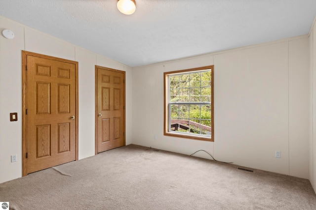 11748 NE Franklin St, Kalkaska, MI 49646 - carpeted empty room with a smoke detector