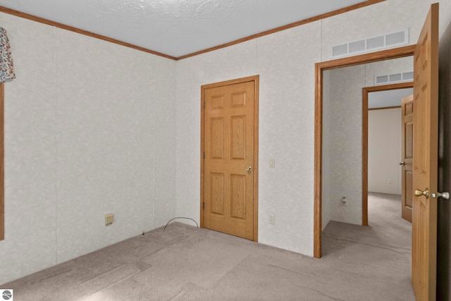 11748 NE Franklin St, Kalkaska, MI 49646 - spare room with carpet floors and ornamental molding