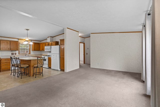 11748 NE Franklin St, Kalkaska, MI 49646 - kitchen with white appliances, a breakfast bar, light countertops, brown cabinetry, and a center island