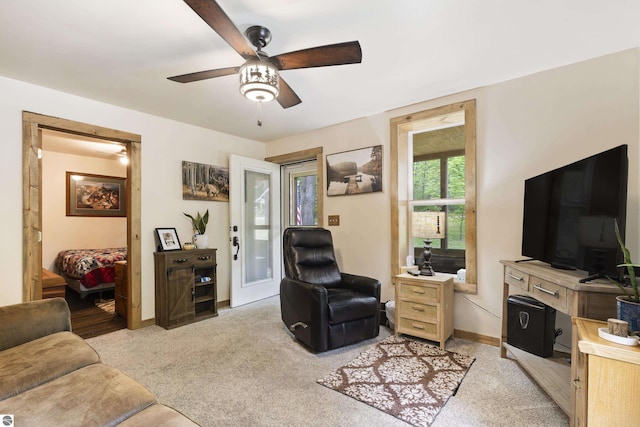16933 3rd St, Copemish, MI 49625 - living area featuring ceiling fan and light carpet