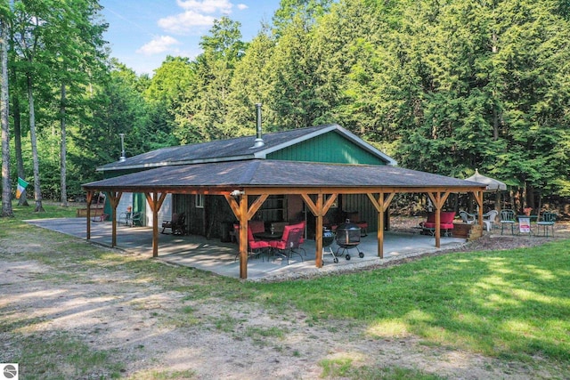 405 E Shetland Trl, Cedar, MI 49621 - view of home's community featuring a gazebo, a patio area, a forest view, and a yard
