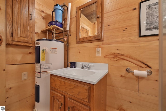 405 E Shetland Trl, Cedar, MI 49621 - bathroom featuring electric water heater, vanity, and wood walls
