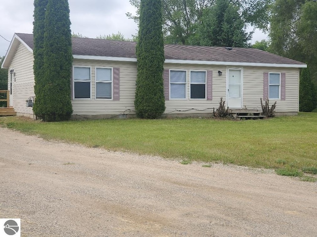 5819 Indian Ln, Weidman, MI 48893 - view of front of property with entry steps, a front yard, and a shingled roof