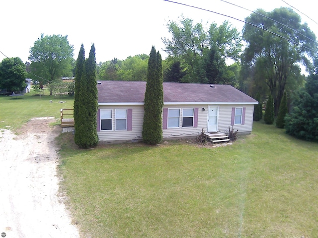5819 Indian Ln, Weidman, MI 48893 - view of front of house featuring driveway and a front yard