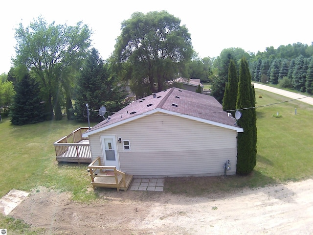 5819 Indian Ln, Weidman, MI 48893 - view of property exterior with a deck and a lawn