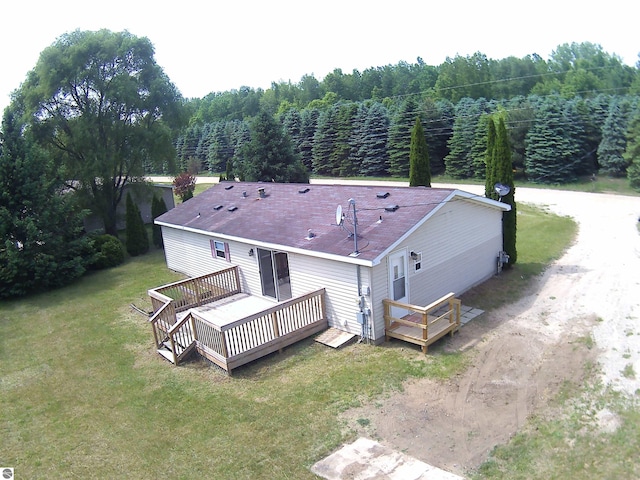 5819 Indian Ln, Weidman, MI 48893 - aerial view of property and surrounding area featuring a heavily wooded area