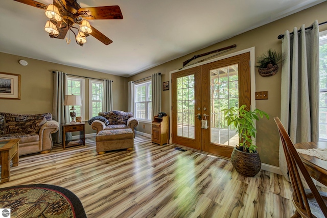 3721 W 18th Rd, Mesick, MI 49668 - living room with french doors, light wood-type flooring, and ceiling fan