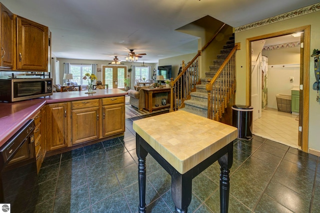 3721 W 18th Rd, Mesick, MI 49668 - kitchen with dishwasher, stainless steel microwave, a peninsula, ceiling fan, and dark countertops