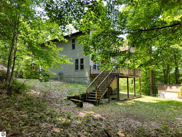 3721 W 18th Rd, Mesick, MI 49668 - view of yard with stairs, a wooden deck, and an outbuilding