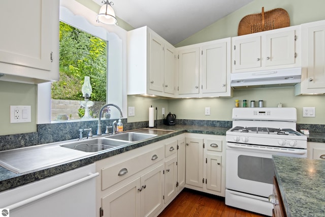 1740 Setterbo Rd, Suttons Bay, MI 49682 - kitchen with white range with gas stovetop, under cabinet range hood, dishwashing machine, dark countertops, and lofted ceiling