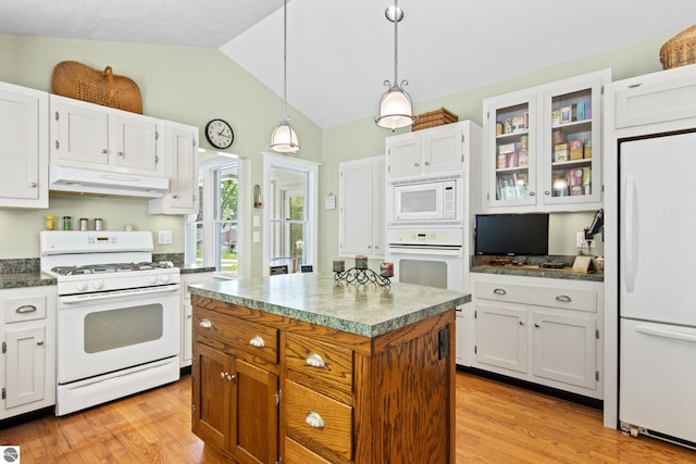 1740 Setterbo Rd, Suttons Bay, MI 49682 - kitchen featuring white appliances, under cabinet range hood, lofted ceiling, light wood-style flooring, and glass insert cabinets