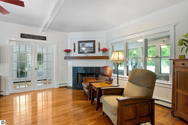 1740 Setterbo Rd, Suttons Bay, MI 49682 - living area featuring baseboard heating, wood finished floors, a ceiling fan, crown molding, and beamed ceiling