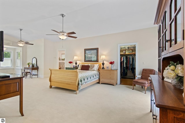 1740 Setterbo Rd, Suttons Bay, MI 49682 - bedroom with light carpet, a walk in closet, a ceiling fan, and a closet