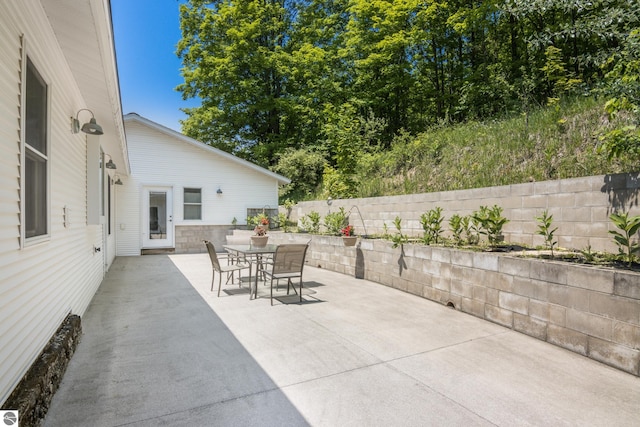 1740 Setterbo Rd, Suttons Bay, MI 49682 - fenced backyard featuring a patio and outdoor dining space