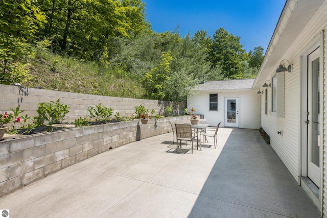 1740 Setterbo Rd, Suttons Bay, MI 49682 - fenced backyard featuring a patio and outdoor dining area