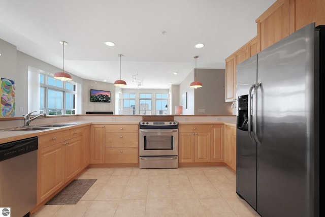 141 Rivers Edge Dr Unit 310, Traverse City, MI 49684 - kitchen featuring appliances with stainless steel finishes, light brown cabinets, light tile patterned flooring, decorative light fixtures, and recessed lighting