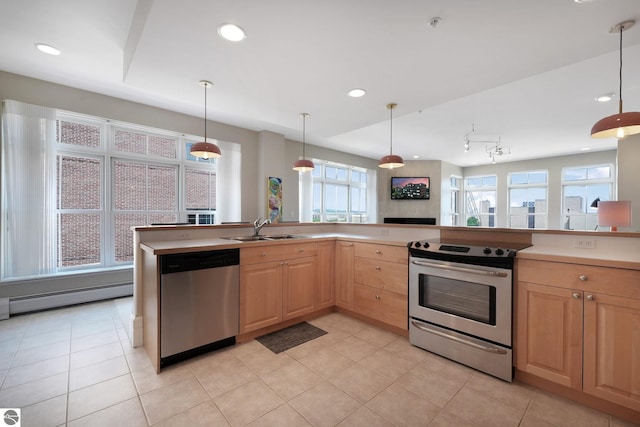 141 Rivers Edge Dr Unit 310, Traverse City, MI 49684 - kitchen with appliances with stainless steel finishes, light brown cabinets, healthy amount of natural light, light tile patterned floors, and recessed lighting