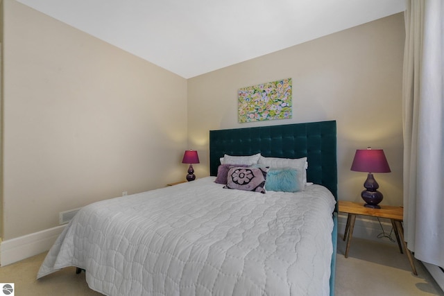 141 Rivers Edge Dr Unit 310, Traverse City, MI 49684 - carpeted bedroom with baseboards