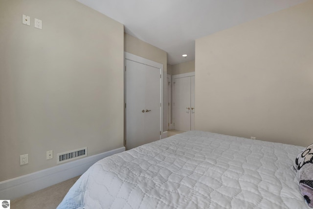 141 Rivers Edge Dr Unit 310, Traverse City, MI 49684 - bedroom with carpet floors and recessed lighting