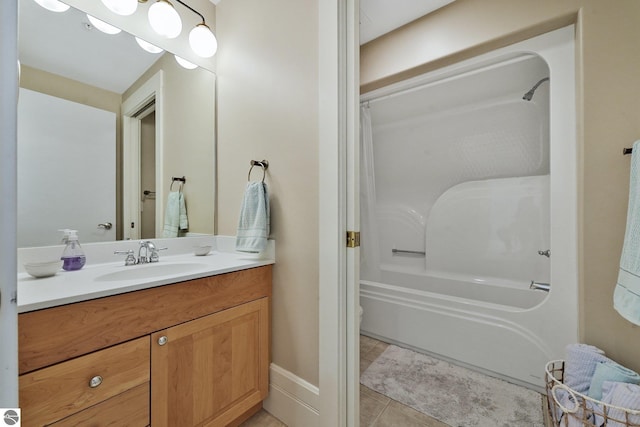 141 Rivers Edge Dr Unit 310, Traverse City, MI 49684 - full bathroom with vanity, shower / bath combo with shower curtain, and tile patterned flooring