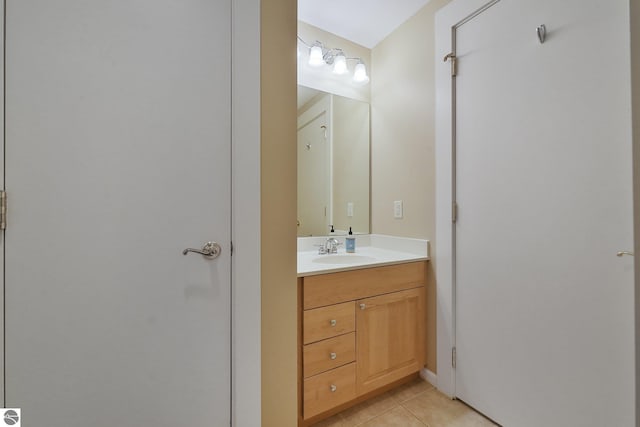 141 Rivers Edge Dr Unit 310, Traverse City, MI 49684 - bathroom with vanity and tile patterned flooring