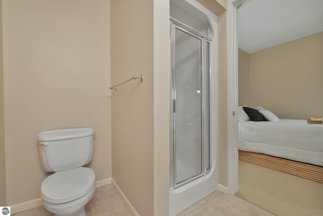 141 Rivers Edge Dr Unit 310, Traverse City, MI 49684 - bathroom featuring a shower stall, tile patterned flooring, and ensuite bathroom