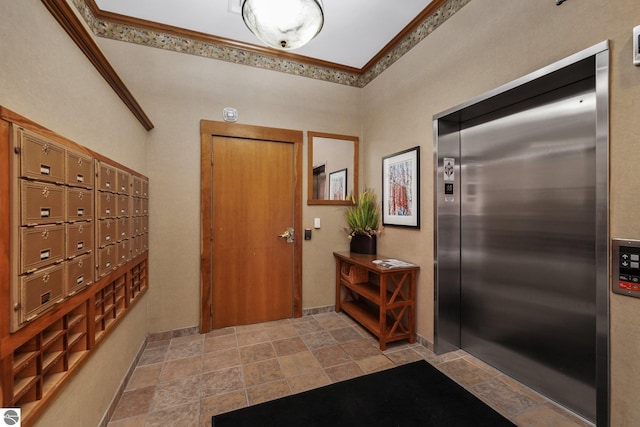 141 Rivers Edge Dr Unit 310, Traverse City, MI 49684 - entryway with elevator, stone finish flooring, mail area, and crown molding