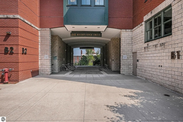 141 Rivers Edge Dr Unit 310, Traverse City, MI 49684 - property entrance with brick siding