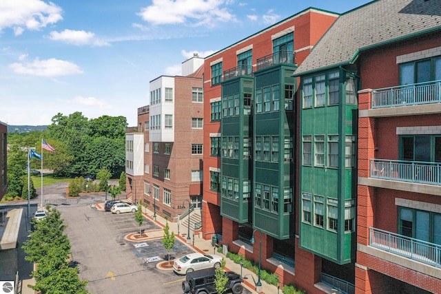 141 Rivers Edge Dr Unit 310, Traverse City, MI 49684 - view of property featuring uncovered parking