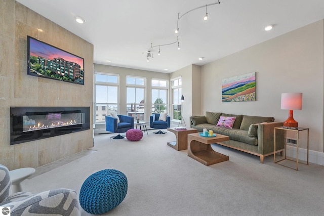 141 Rivers Edge Dr Unit 310, Traverse City, MI 49684 - living area with carpet flooring, a fireplace, and recessed lighting