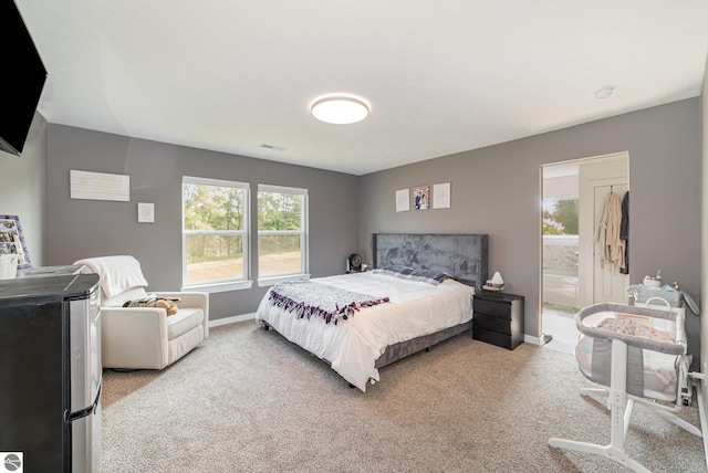 3468 Kali Ln, Alma, MI 48801 - bedroom featuring light carpet and baseboards