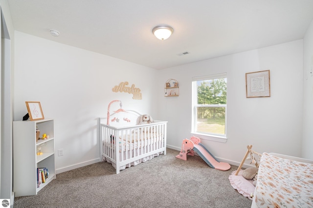 3468 Kali Ln, Alma, MI 48801 - bedroom with carpet flooring and a nursery area