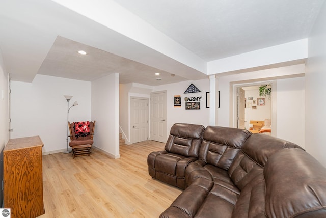3468 Kali Ln, Alma, MI 48801 - living area featuring stairway, light wood-style flooring, and recessed lighting