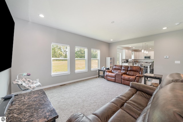 3468 Kali Ln, Alma, MI 48801 - carpeted living room featuring recessed lighting and baseboards
