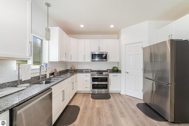 3468 Kali Ln, Alma, MI 48801 - kitchen featuring appliances with stainless steel finishes, dark stone countertops, white cabinetry, and recessed lighting