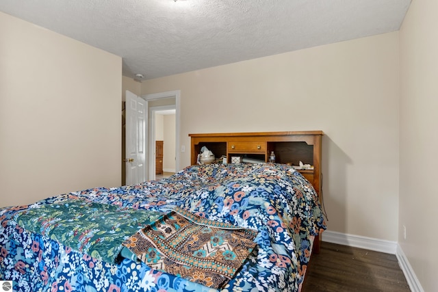 2733 Windcrest Ln, Traverse City, MI 49686 - bedroom featuring wood finished floors and a textured ceiling